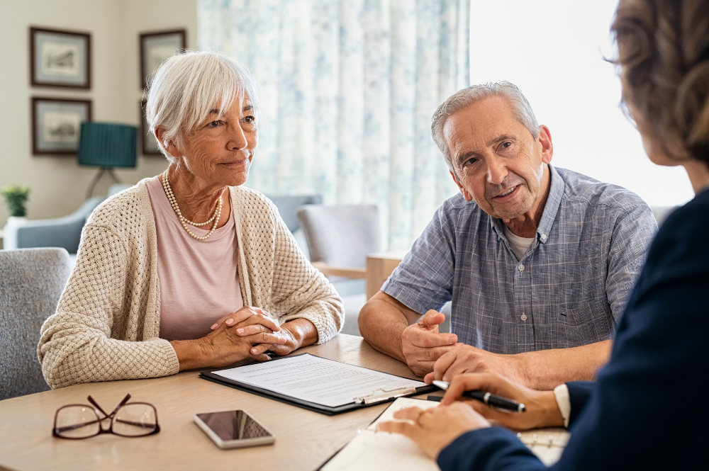 A senior couple consults with a financial advisor about comprehensive retirement planning strategies.