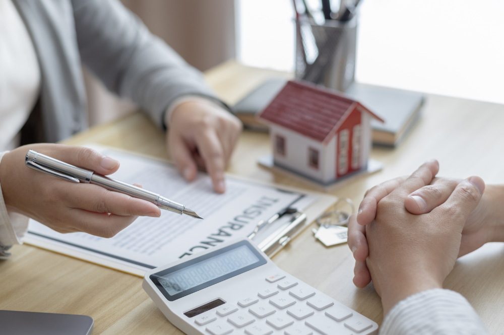 A real estate agent and a client discuss home purchase options, emphasizing estate planning essentials for future security.